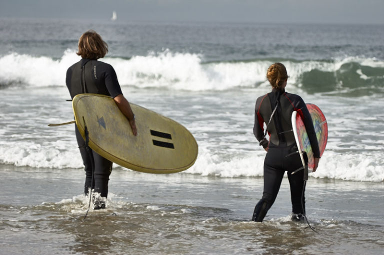 The Director taking Amanda out for daily surf practice.